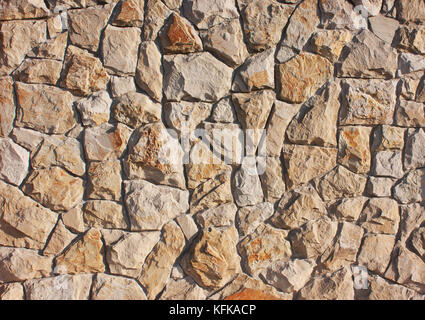 Background of brown, red stones in a chaotic manner, style of antique, medieval, concrete texture Stock Photo
