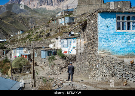 Daily life in the highest village of Azerbaijan. Houses on the top of Khinalig village, Quba region, Azerbaijan. Khinalig is an ancient village deep in the Caucasian mountains on the height of more than 2,300 meters above the sea level. Stock Photo