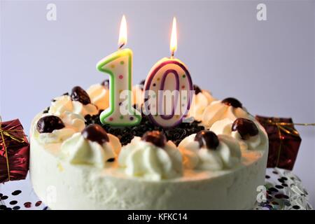 An image of a birthday cake with candles - 10 Stock Photo