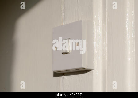 Light switch inside house with door frame Stock Photo
