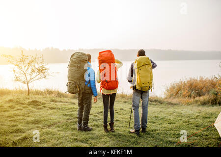 Hikers with backpacks outdoors Stock Photo