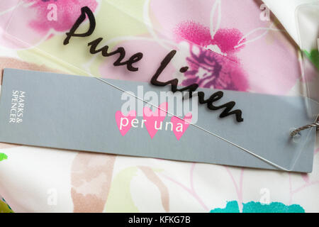 Pure Linen and Per Una Marks & Spencer tags on woman's top Stock Photo