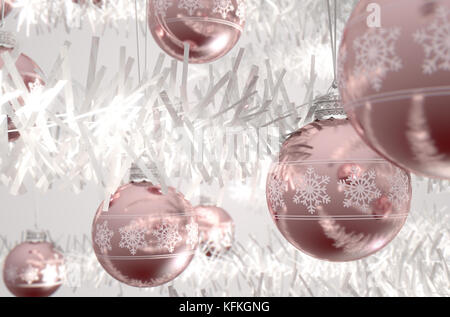 Rose gold christmas baubles decorated with fine ornate snowflake patterns hanging from a fake white christmas  - 3D render Stock Photo