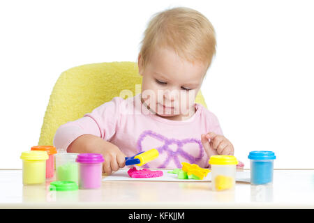 Child playing with plasticine Stock Photo