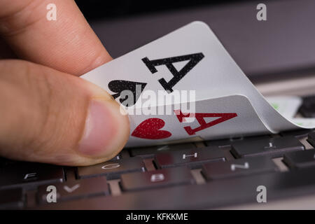 Aces on computer keyboard. Online gambling concept Stock Photo