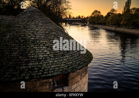 The river Ouse in the city of York, England. Taken from the bridge across the river at sunset.