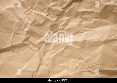 Crumpled craft paper close up. Texture and background Stock Photo