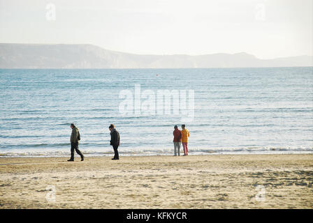 Weymouth, UK. 30th Oct, 2017. UK Weather. A sunny but chilly start to the day in Weymouth and people enjoy an early morning stroll on the beach Credit: stuart fretwell/Alamy Live News Stock Photo