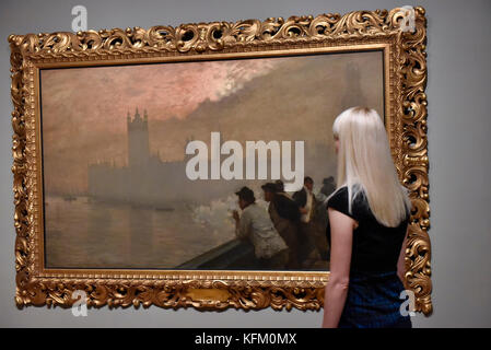 London, UK. 30th Oct, 2017. A staff member views 'Westminster', 1878, by Giuseppe de Nittis at a preview of 'Impressionists in London, French Artists in Exile (1870-1904)' at Tate Britain. The exhibition brings together over 100 works by Monet, Tissot, Pissarro and others in the first scale show of French artists who sought refuge in Britain during the Franco-Prussian War and shows views of London as seen through French eyes. The exhibition runs 2 November 2017 to 29 April 2018. Credit: Stephen Chung/Alamy Live News