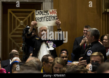 Washington, District Of Columbia, USA. 30th Oct, 2017. A protester holds an anti-war protest sign during a Senate Foreign Relations Committee hearing on United States Presidential military authority at the United States Capitol in Washington, DC Credit: Alex Edelman/ZUMA Wire/Alamy Live News Stock Photo