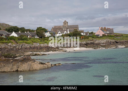 Iona Abbey and coastal houses seen from Sound of Mull Scotland Stock Photo