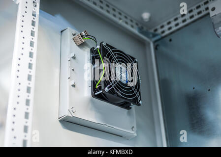 Electric cooling fan in industrial enclosure, power distribution industry. Stock Photo