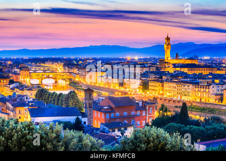 Florence, Tuscany - Night scenery Arno River and Palazzo Vecchio, Renaissance architecture in Italy. Stock Photo