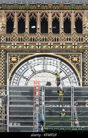 Westminster, London, UK. 13th October 2017. Workmen reach half a clock face with scaffolding on the Elizabeth Tower otherwise known as Big Ben Stock Photo