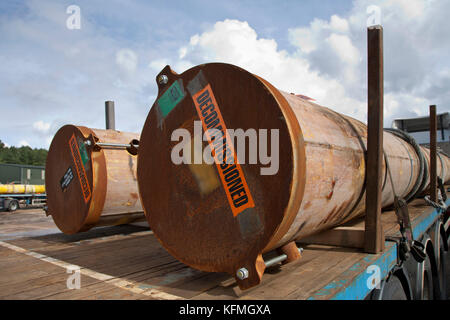 Decommissioned pipe sections used in the North Sea oil and gas industry being delivered to Norfolk scrap metal yard in UK by ARR Craib haulage. Stock Photo