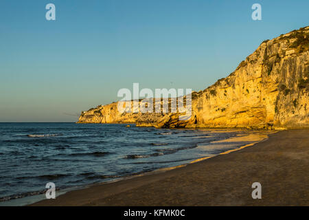 The rocky headlands of Peschici, Italy dotted with traditional fishing towers called trabucco, Gargano National Park, Puglia. Stock Photo