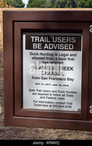 sign posted Duck hunting advisory at Alameda Creek Regional Trail, California Stock Photo