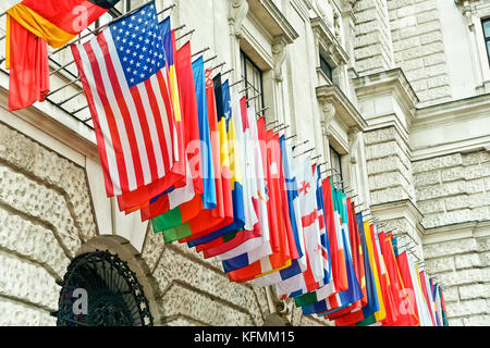 Hofburg  former Imperial Palace. Currently residence of the Austrian President and complex of different museums. International set of flags. Vienna. Stock Photo