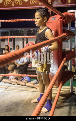 Asian Female Muay Thai Boxer Receiving Kick Sending Sweat Flying At ...