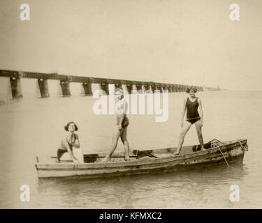Women on a boat, Historic Florida Keys with Overseas Railroad Bridge. Stock Photo