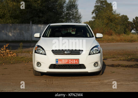 DNIPRO, UKRAINE - SEPTEMBER 05, 2017: KIA CEED WHITE COLOR NEAR THE ROAD IN THE DNIPRO CITY Stock Photo