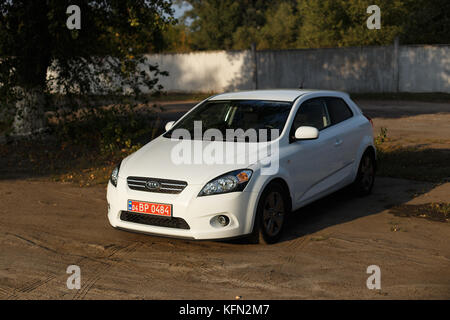 DNIPRO, UKRAINE - SEPTEMBER 05, 2017: KIA CEED WHITE COLOR NEAR THE ROAD IN THE DNIPRO CITY Stock Photo