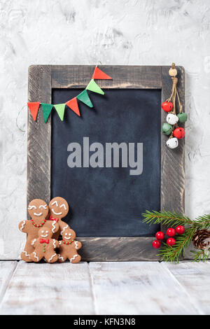 Gingerbread man family and chalkboard Stock Photo