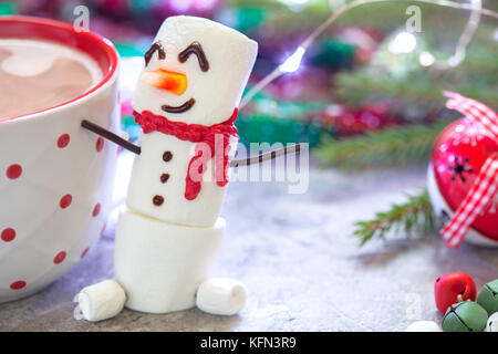 Hot chocolate with melted snowman Stock Photo