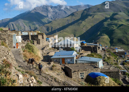 Daily life in the highest village of Azerbaijan. Houses on the top of Khinalig village, Quba region, Azerbaijan. Khinalig is an ancient village deep in the Caucasian mountains on the height of more than 2,300 meters above the sea level. Stock Photo