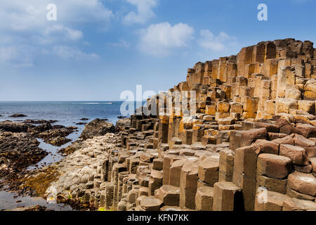 The Giants Causeway in County Antrim of Northern Ireland is declared a World Heritage Site by UNESCO containing about 40000 interlocking basalt column Stock Photo