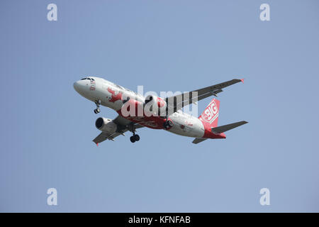 CHIANGMAI, THAILAND -DECEMBER 16 2015: 9M-AHJ Airbus A320-200 of Airasia. Landing to Chiangmai airport from Kuala lumpur, Malaysia. Stock Photo