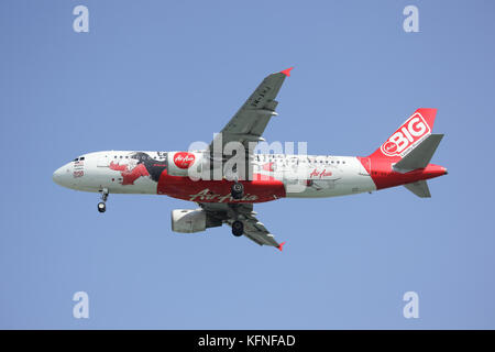 CHIANGMAI, THAILAND -DECEMBER 16 2015: 9M-AHJ Airbus A320-200 of Airasia. Landing to Chiangmai airport from Kuala lumpur, Malaysia. Stock Photo