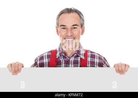 Technician Holding Blank Placard On White Background Stock Photo