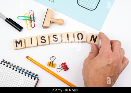 mission concept. Wooden letters on a white background Stock Photo