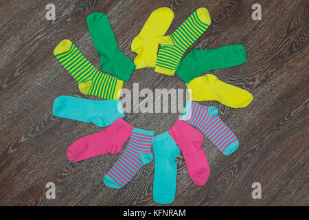 One striped sock in yellow, orange, white, red-haired brown stripes. 5  colors. isolated Stock Photo - Alamy