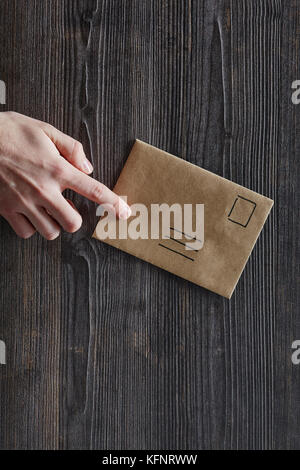 index finger pointing on unadressed letter Stock Photo