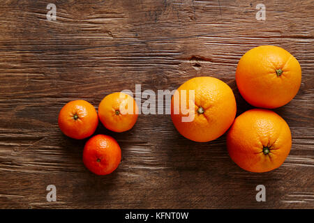 three mandarines and three oranges Stock Photo