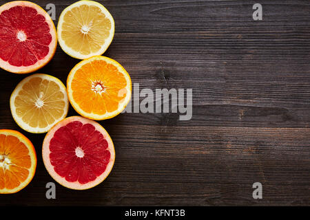 grapefruit orange and sweety halves on left side Stock Photo