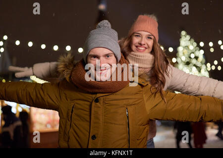 happy couple having fun at christmas market Stock Photo
