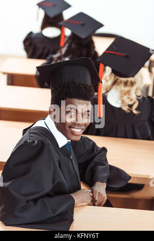 african american student in graduation costume Stock Photo