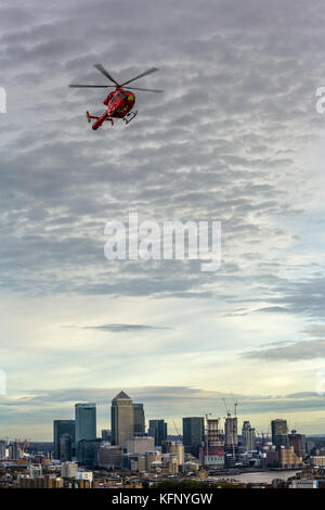 London Air Ambulance helicopter returning to helipad on the Royal London Hospital. Stock Photo