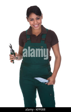 Young Female Gardner With Gardening Tools Isolated Over White Background Stock Photo