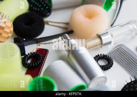 hair styling sprays, curlers and scrunchies Stock Photo