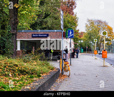 Berlin Wannsee,Entrance to S-Bahn train station,part of BVG commuter network,atumn foliage on trees,street view Stock Photo