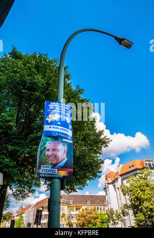 Berlin,Tegel.Hallen am Borsigturm,Berliner Strasse street view with election poster on Lamppost,old buildings, Stock Photo