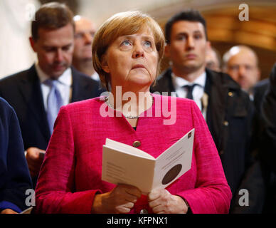 Wittenberg, Germany. 31st Oct, 2017. German Chancellor Angela Merkel (CDU) attends a church service marking the 500th anniversary of the beginning of the Reformation, at the Schlosskirche (Castle Church) in Wittenberg, Germany, 31 October 2017. Credit: dpa picture alliance/Alamy Live News Stock Photo