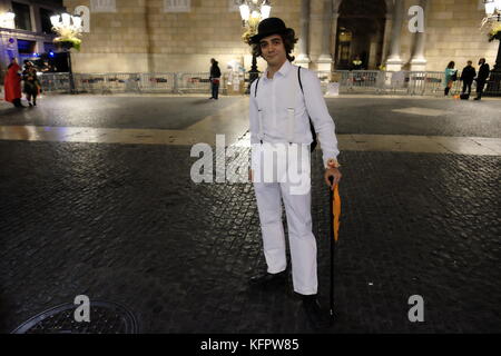Barcelona, Spain. 31st Oct, 2017. A man wearing a 'Clockwork Orange' Halloween costume stands in Plaça de Sant Jaume. Joe O'Brien/Alamy Live News Stock Photo