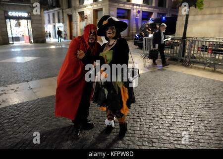 Barcelona, Spain. 31st Oct, 2017. People wearing Halloween costumes, stand in front of Catalan police (Mossos) in Plaça de Sant Jaume. Joe O'Brien/Alamy Live News Stock Photo