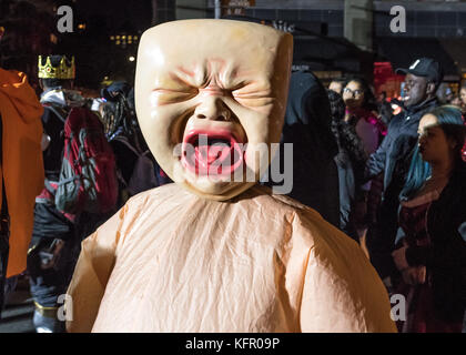 New York, USA. 31st Oct, 2017. Revelers wear costumes as they march through New York's 6th Avenue during the Greenwich Village Halloween Parade. Credit: Enrique Shore/Alamy Live News Stock Photo