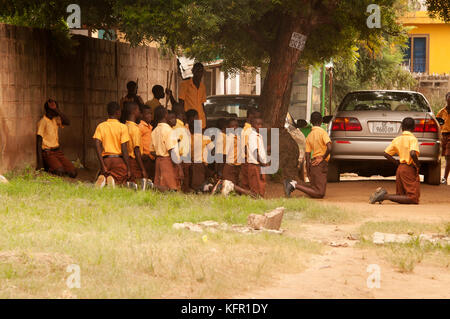 Pupils being punished in Accra, Ghana Stock Photo